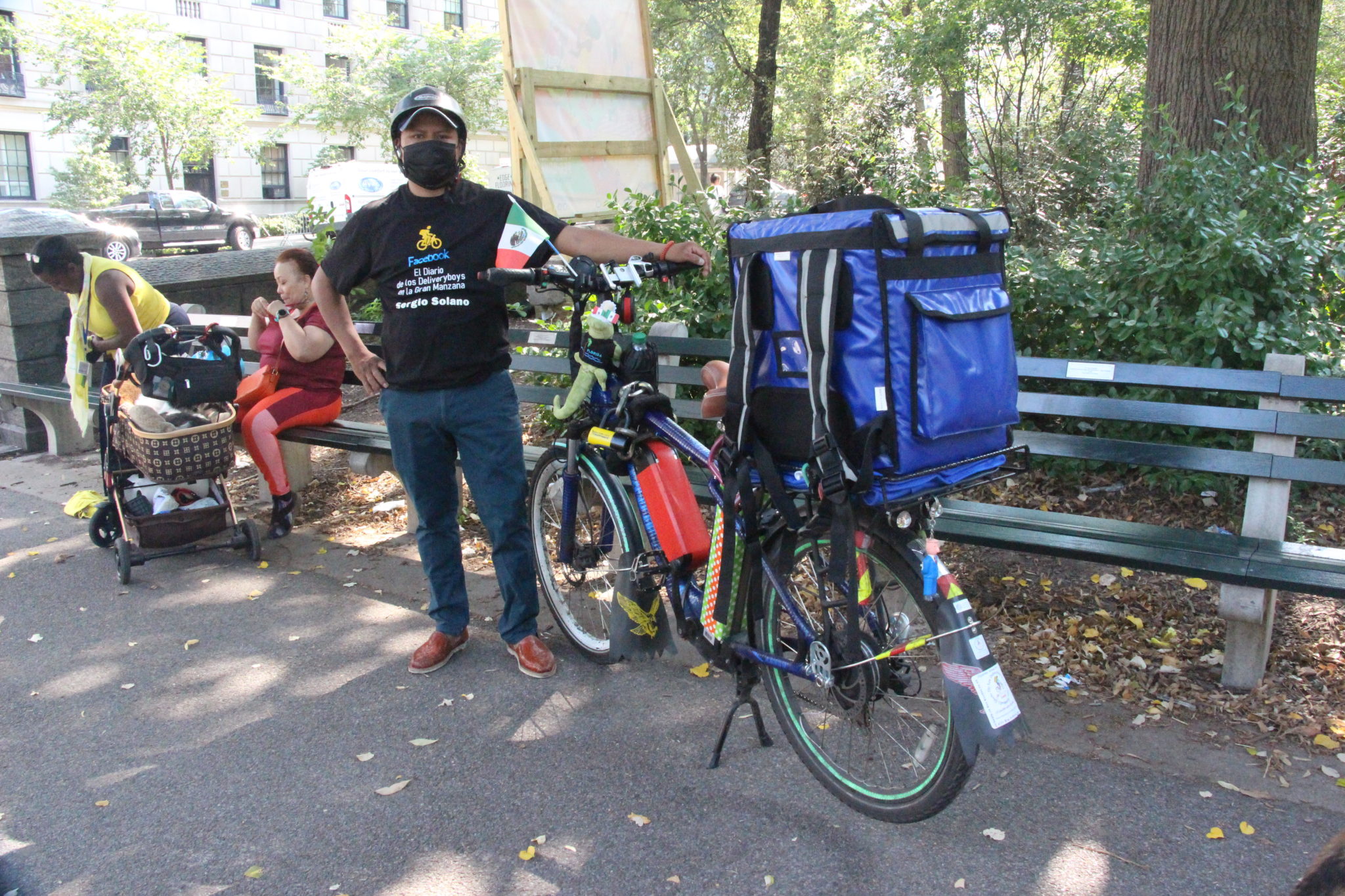 A delivery cyclist and his e-bike